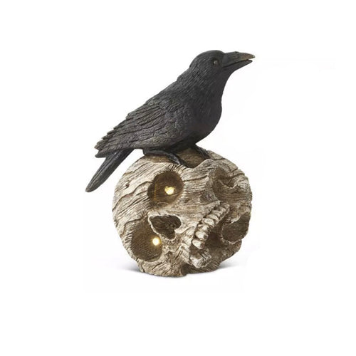 Rabe auf Totenschädel mit LED Augen